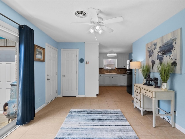 1901 49th St, Galveston, TX 77551 - entryway featuring light tile patterned floors and a ceiling fan