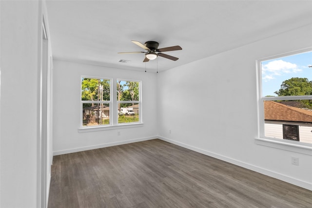 7613 Shotwell St, Houston, TX 77016 - empty room featuring plenty of natural light, wood finished floors, and a ceiling fan