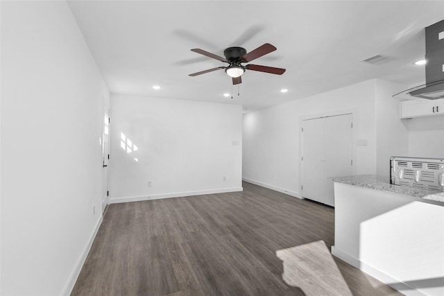 7613 Shotwell St, Houston, TX 77016 - unfurnished living room featuring ceiling fan, recessed lighting, and dark wood-type flooring