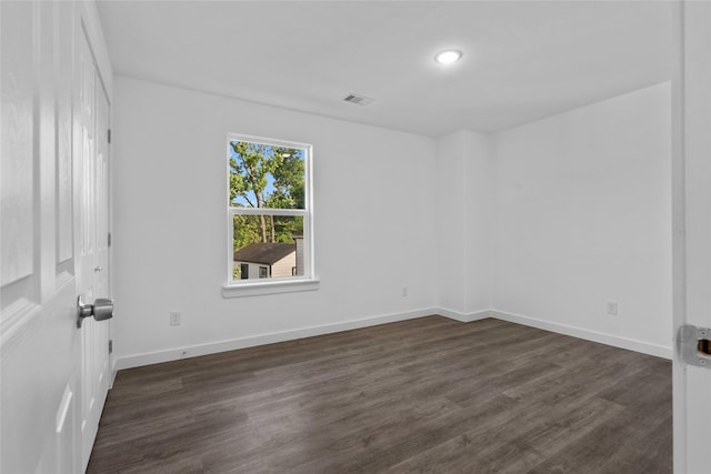 7613 Shotwell St, Houston, TX 77016 - unfurnished room with dark wood-style flooring and recessed lighting