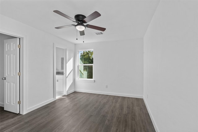 7613 Shotwell St, Houston, TX 77016 - empty room with dark wood finished floors and a ceiling fan