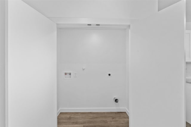 7613 Shotwell St, Houston, TX 77016 - washroom with hookup for an electric dryer, gas dryer hookup, washer hookup, and wood finished floors