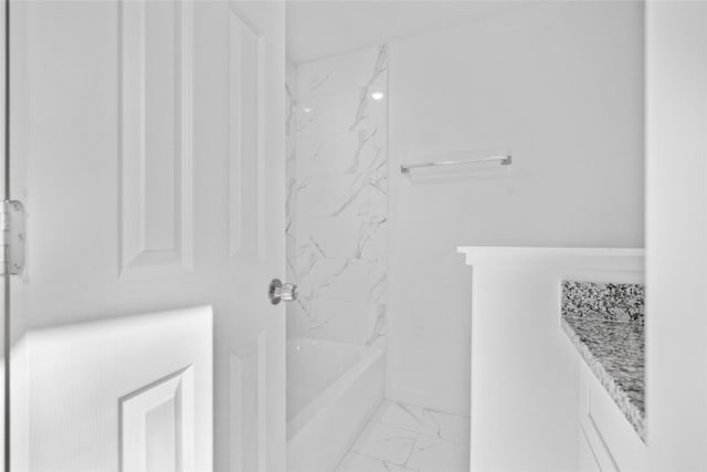 7613 Shotwell St, Houston, TX 77016 - full bath featuring marble look tile flooring and bathing tub / shower combination