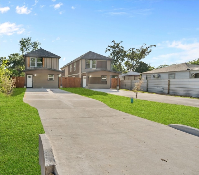 7613 Shotwell St, Houston, TX 77016 - view of front of home with board and batten siding and concrete driveway