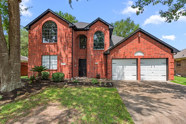 25807 Oakridge Forest Ln, Spring, TX 77386 - traditional home with brick siding, a garage, driveway, and a shingled roof
