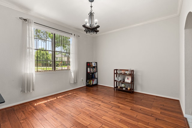 25807 Oakridge Forest Ln, Spring, TX 77386 - spare room with crown molding, a chandelier, and wood finished floors
