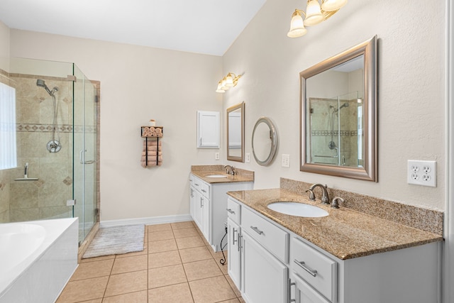 25807 Oakridge Forest Ln, Spring, TX 77386 - bathroom with a stall shower, two vanities, a garden tub, and tile patterned floors