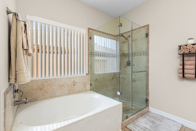 25807 Oakridge Forest Ln, Spring, TX 77386 - full bath featuring a garden tub, a shower stall, and plenty of natural light
