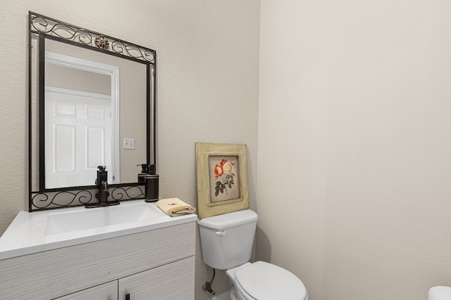 25807 Oakridge Forest Ln, Spring, TX 77386 - bathroom featuring vanity and a textured wall