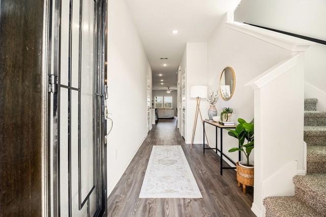 23242 Spring Genesis Ln, Katy, TX 77493 - hallway with stairs, wood finished floors, and recessed lighting