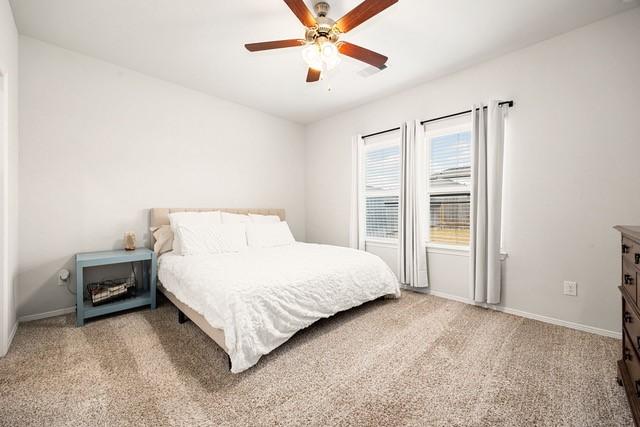 23242 Spring Genesis Ln, Katy, TX 77493 - bedroom with carpet flooring and a ceiling fan