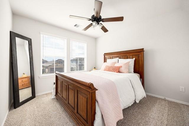 23242 Spring Genesis Ln, Katy, TX 77493 - bedroom featuring light carpet and a ceiling fan