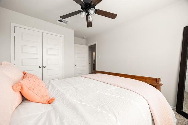 23242 Spring Genesis Ln, Katy, TX 77493 - carpeted bedroom with a closet and ceiling fan
