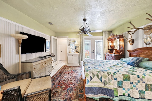 12148 Stone W Dr, Houston, TX 77035 - bedroom with french doors, access to exterior, and a textured ceiling