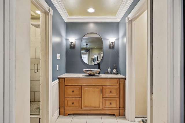 12148 Stone W Dr, Houston, TX 77035 - bathroom featuring crown molding, vanity, a shower stall, tile patterned floors, and a wainscoted wall