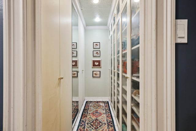 12148 Stone W Dr, Houston, TX 77035 - hallway featuring ornamental molding and a textured ceiling