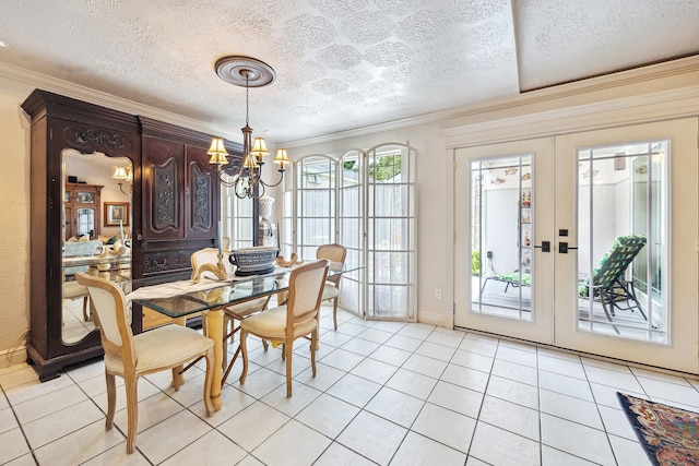 12148 Stone W Dr, Houston, TX 77035 - dining space with a chandelier, ornamental molding, french doors, light tile patterned flooring, and a textured ceiling