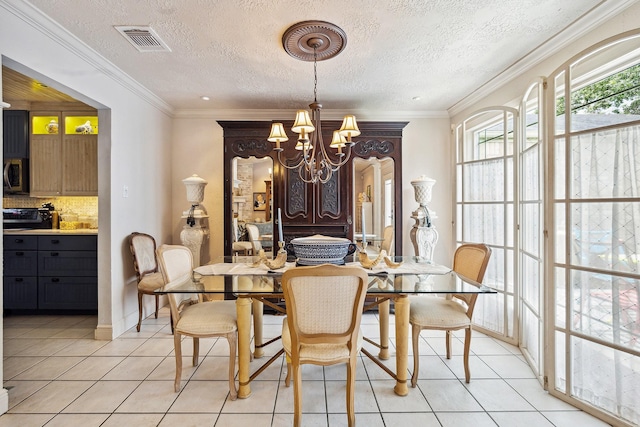 12148 Stone W Dr, Houston, TX 77035 - dining room featuring a chandelier, light tile patterned floors, a textured ceiling, and ornamental molding