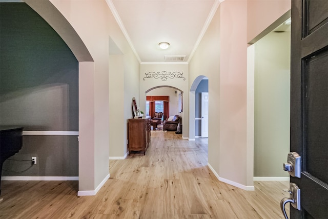 13330 Via Torre De Pisa Ln, Cypress, TX 77429 - entrance foyer with crown molding, light wood finished floors, and arched walkways