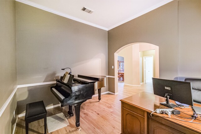 13330 Via Torre De Pisa Ln, Cypress, TX 77429 - office area with arched walkways, crown molding, and light wood-style floors
