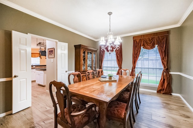 13330 Via Torre De Pisa Ln, Cypress, TX 77429 - dining room with a chandelier, crown molding, and light wood finished floors