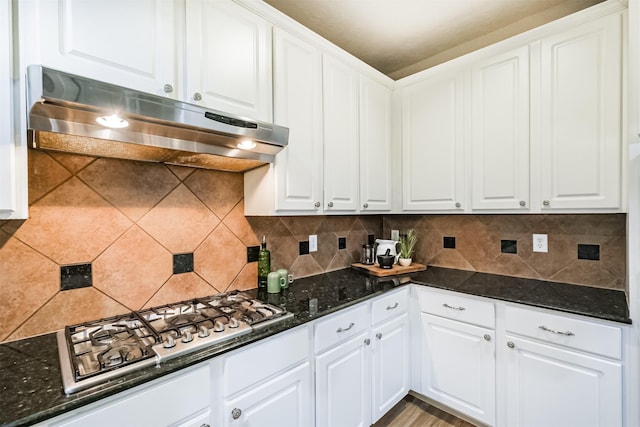 13330 Via Torre De Pisa Ln, Cypress, TX 77429 - kitchen with under cabinet range hood, stainless steel gas cooktop, and white cabinets