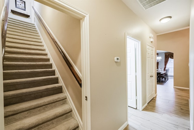 13330 Via Torre De Pisa Ln, Cypress, TX 77429 - staircase featuring arched walkways, wood finished floors, and crown molding