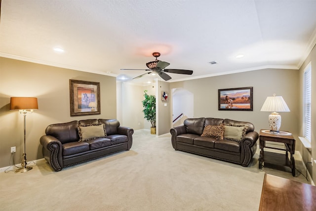 13330 Via Torre De Pisa Ln, Cypress, TX 77429 - living room with carpet floors, a ceiling fan, crown molding, recessed lighting, and arched walkways