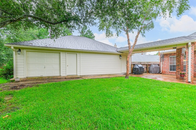 13330 Via Torre De Pisa Ln, Cypress, TX 77429 - view of green lawn featuring a garage and a patio