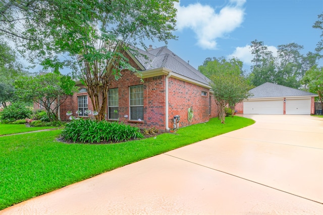 13330 Via Torre De Pisa Ln, Cypress, TX 77429 - view of property exterior featuring brick siding, a detached garage, a lawn, and concrete driveway
