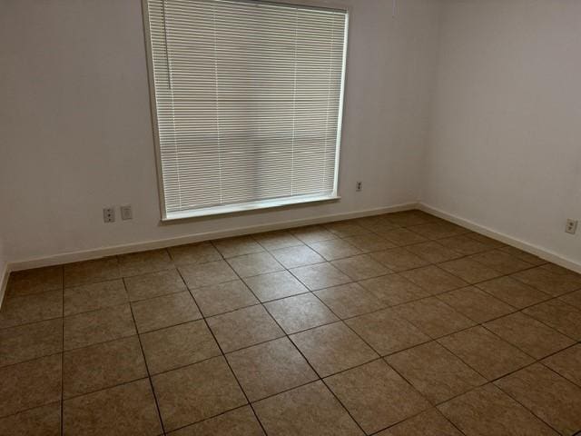 16310 Meadowbrook Farm Rd, Houston, TX 77082 - tiled empty room featuring baseboards