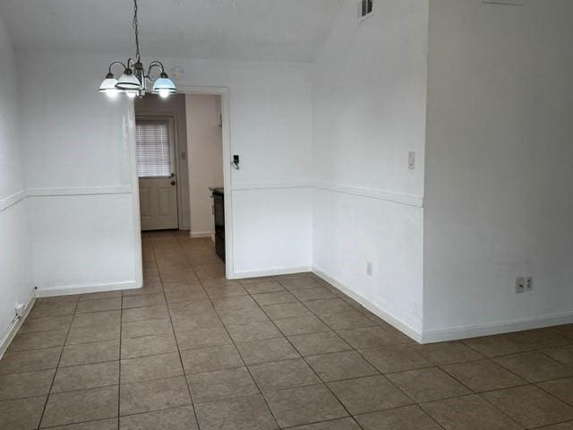 16310 Meadowbrook Farm Rd, Houston, TX 77082 - unfurnished dining area featuring tile patterned flooring and a chandelier