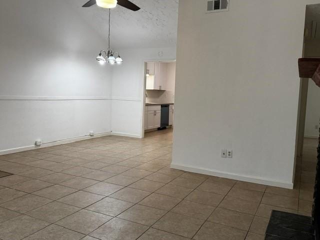 16310 Meadowbrook Farm Rd, Houston, TX 77082 - spare room featuring ceiling fan, light tile patterned flooring, lofted ceiling, and a chandelier