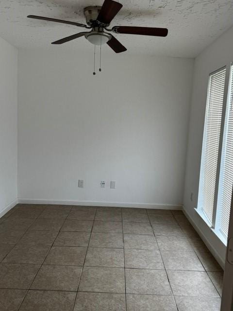 16310 Meadowbrook Farm Rd, Houston, TX 77082 - spare room featuring light tile patterned floors and a ceiling fan