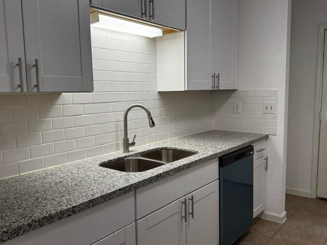 16310 Meadowbrook Farm Rd, Houston, TX 77082 - kitchen featuring dishwasher, light stone countertops, backsplash, tile patterned flooring, and white cabinetry