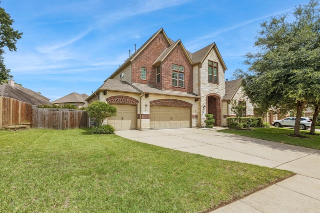 47 Chestnut Meadow Dr, Conroe, TX 77384 - view of front of house featuring driveway, stone siding, brick siding, and an attached garage