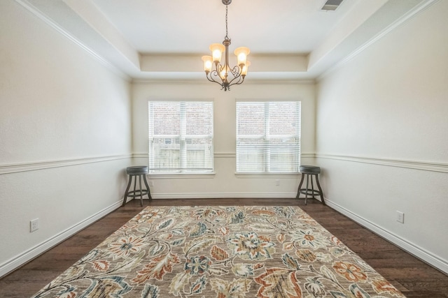 47 Chestnut Meadow Dr, Conroe, TX 77384 - spare room with a tray ceiling, a chandelier, and wood finished floors