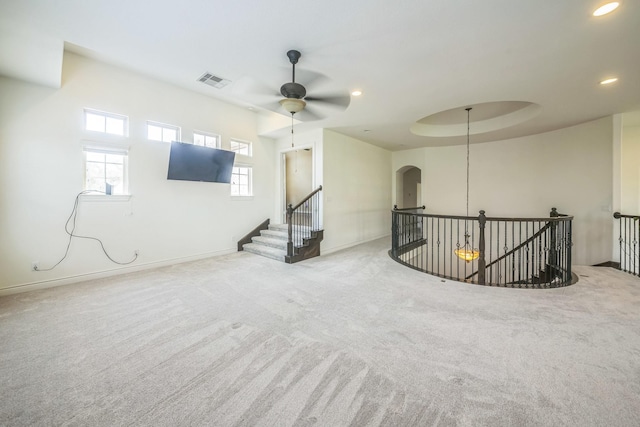 47 Chestnut Meadow Dr, Conroe, TX 77384 - carpeted empty room with a ceiling fan, arched walkways, and recessed lighting