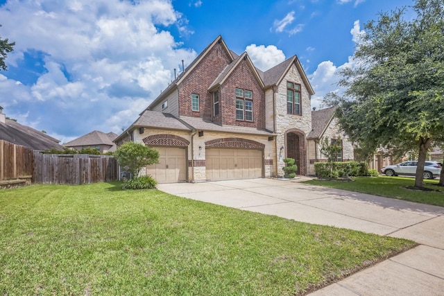 47 Chestnut Meadow Dr, Conroe, TX 77384 - view of front of home featuring stone siding, driveway, brick siding, and an attached garage