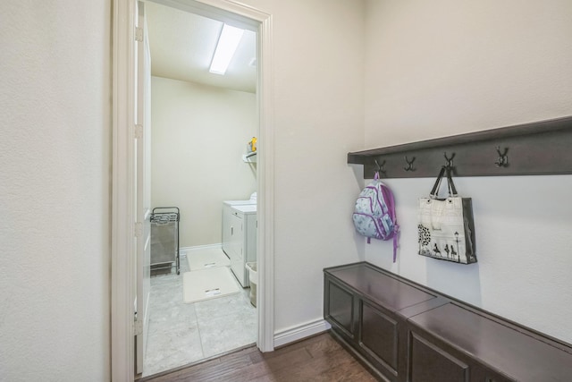 47 Chestnut Meadow Dr, Conroe, TX 77384 - mudroom with separate washer and dryer and dark wood-type flooring