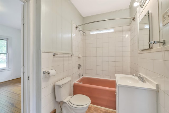 702 Caplin St, Houston, TX 77022 - bathroom featuring tile walls, vanity, shower / washtub combination, and crown molding