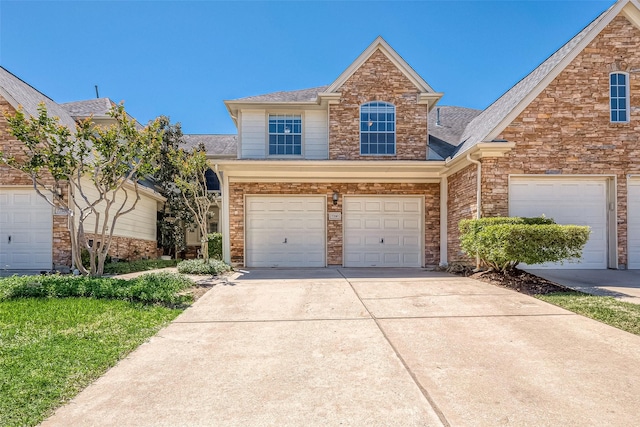 7210 Welshwood Ln, Sugar Land, TX 77479 - traditional-style home with concrete driveway, stone siding, roof with shingles, and a garage