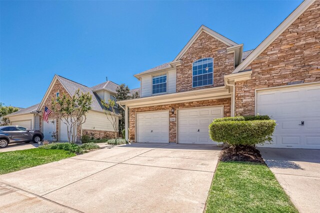 7210 Welshwood Ln, Sugar Land, TX 77479 - traditional-style home with an attached garage, driveway, and stone siding