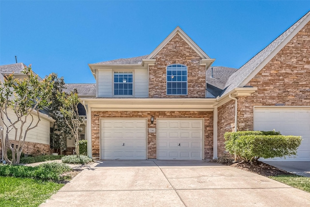 7210 Welshwood Ln, Sugar Land, TX 77479 - traditional-style home with stone siding, driveway, a shingled roof, and an attached garage