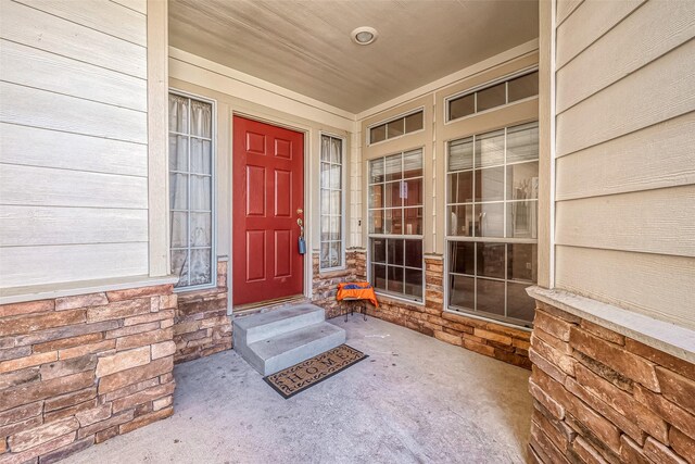 7210 Welshwood Ln, Sugar Land, TX 77479 - doorway to property featuring stone siding
