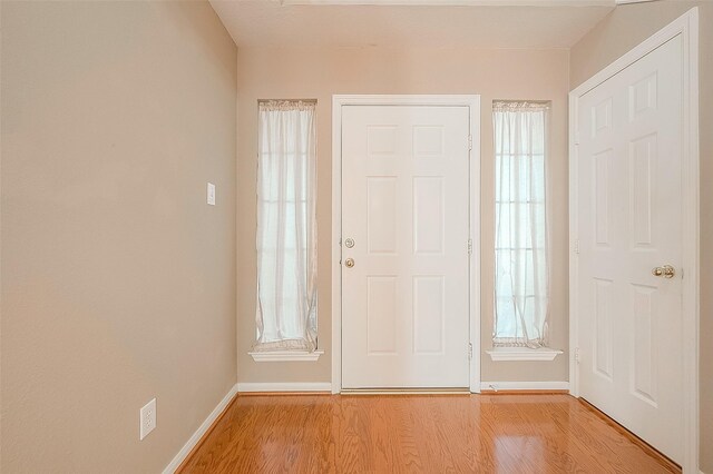 7210 Welshwood Ln, Sugar Land, TX 77479 - entrance foyer featuring light wood-style floors and plenty of natural light