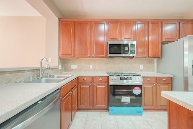 7210 Welshwood Ln, Sugar Land, TX 77479 - kitchen with stainless steel appliances, light countertops, and brown cabinets