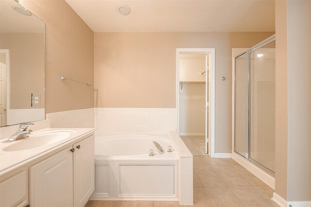 7210 Welshwood Ln, Sugar Land, TX 77479 - full bathroom with a bath, a stall shower, tile patterned flooring, and vanity