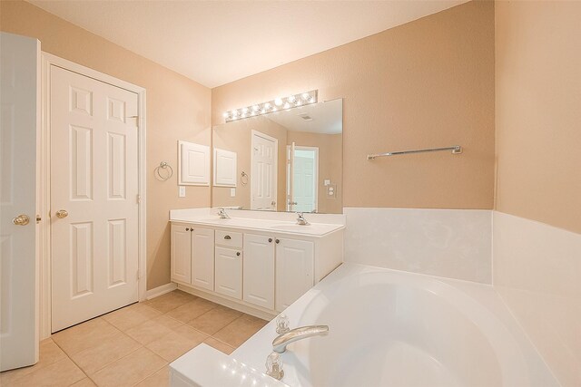 7210 Welshwood Ln, Sugar Land, TX 77479 - full bath featuring tile patterned floors, a garden tub, and double vanity