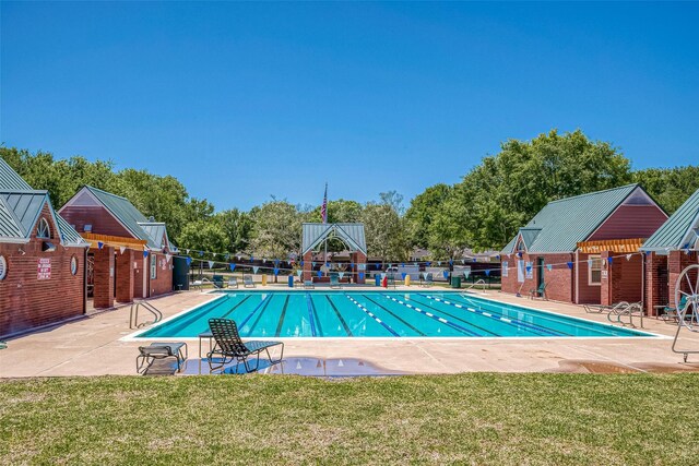 7210 Welshwood Ln, Sugar Land, TX 77479 - community pool featuring a patio and view of scattered trees